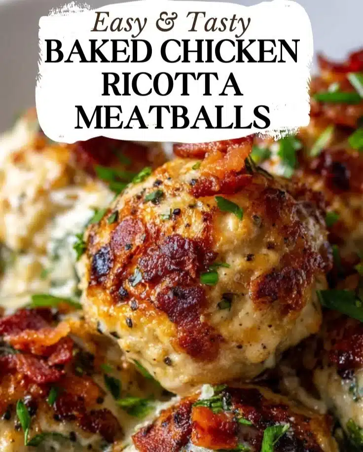 Baked Chicken Ricotta Meatballs served on a plate with fresh herbs