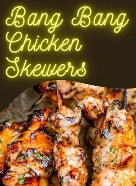 Delicious Bang Bang Chicken Skewers served with spicy sauce