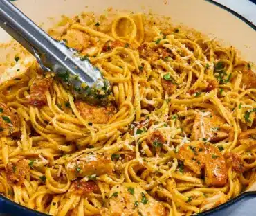 Delicious plate of chicken carbonara with creamy sauce and crispy bacon
