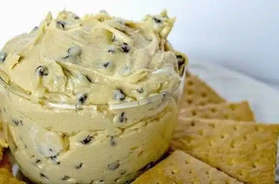 Delicious Buckeye Dip served with pretzels and apples