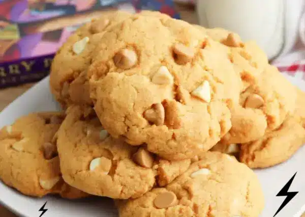 Delicious Butterbeer Cookies served on a plate with a frothy topping.