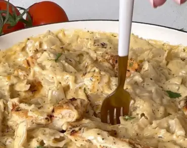 Creamy chicken garlic parmesan pasta served in a bowl with herbs