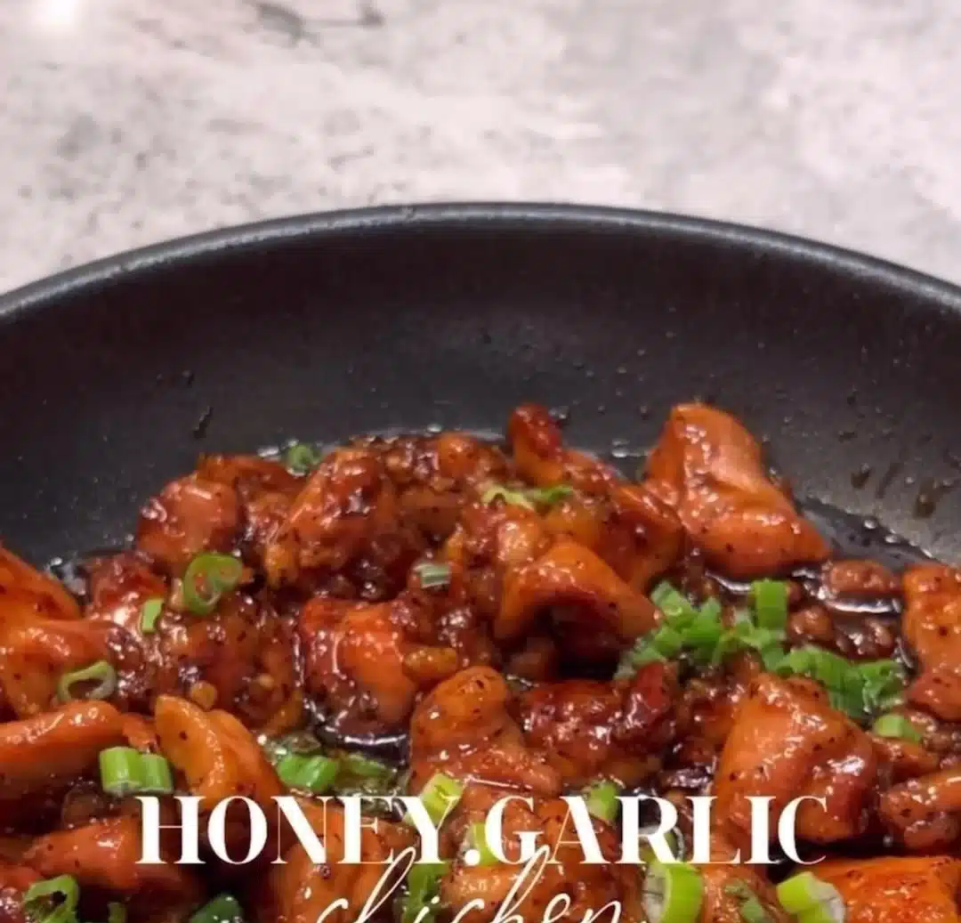 Plate of honey garlic chicken served with vegetables and rice