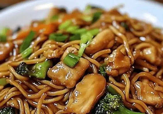 Extra Saucy Garlic Chicken Lo Mein dish with chicken and vegetables in a bowl