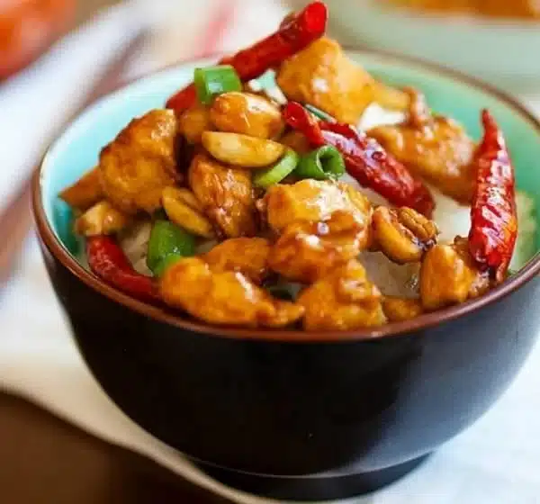 Delicious Kung Pao Chicken dish served with vegetables and rice