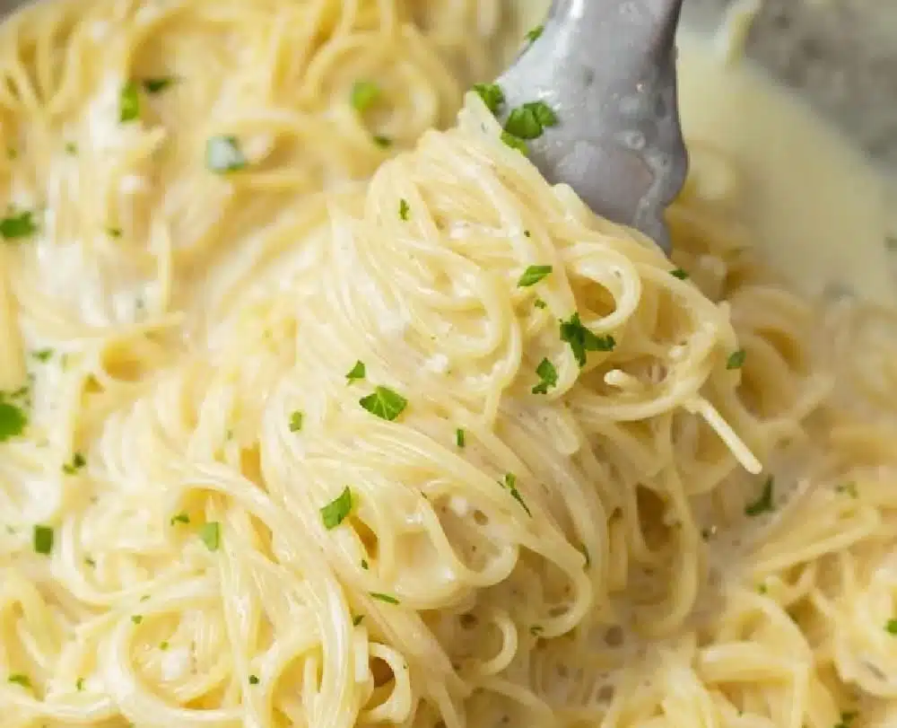 One Pot Garlic Parmesan Pasta cooked with garlic and parmesan cheese in a creamy sauce.