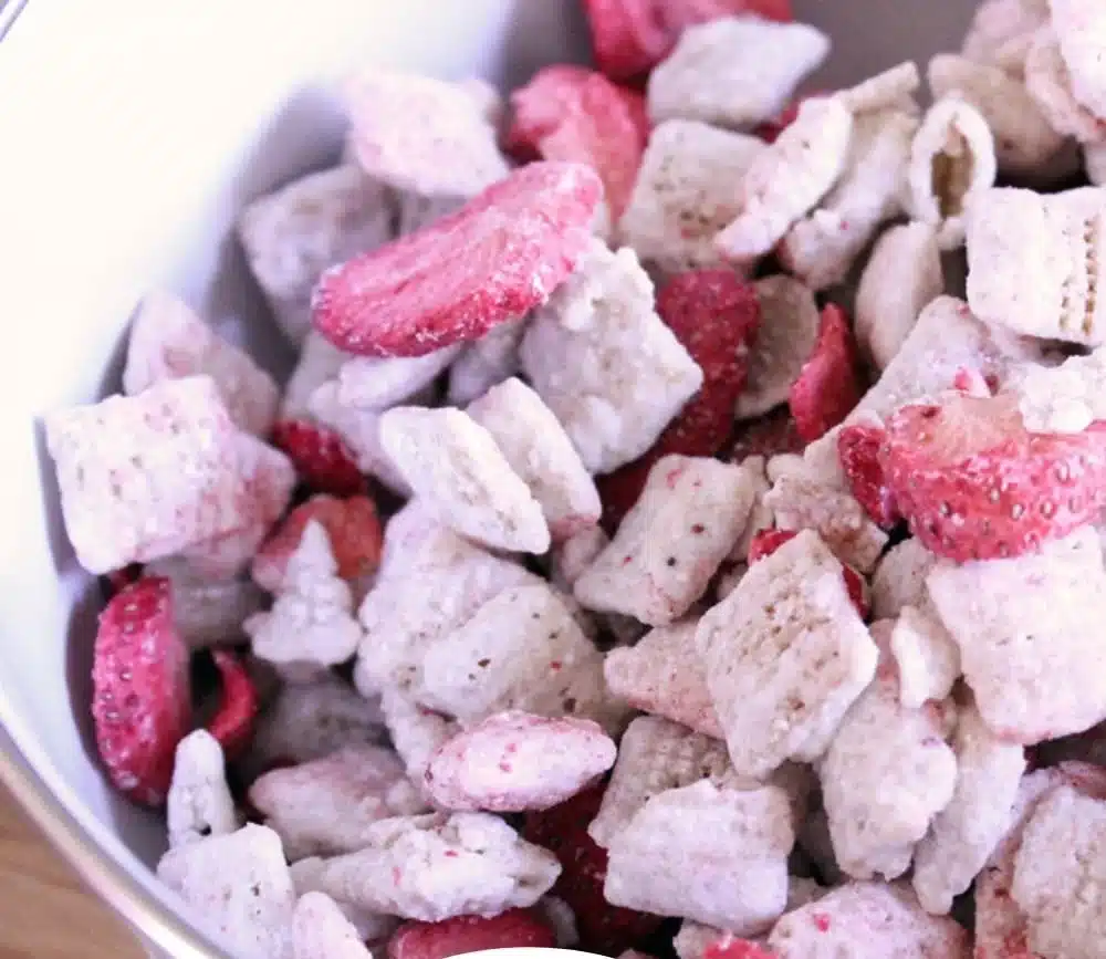 Delicious Strawberry Lemonade Chex Mix snack in a colorful bowl.