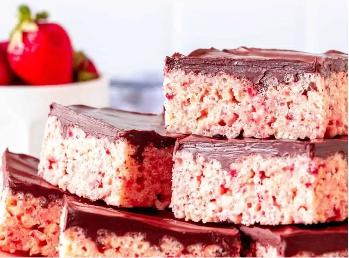 Strawberry Rice Krispie Treats topped with fresh strawberries.